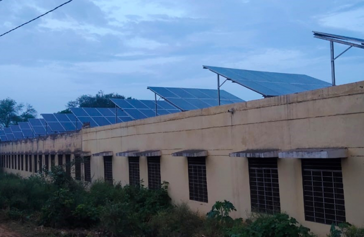 Solar panels affixed to a rooftop in India